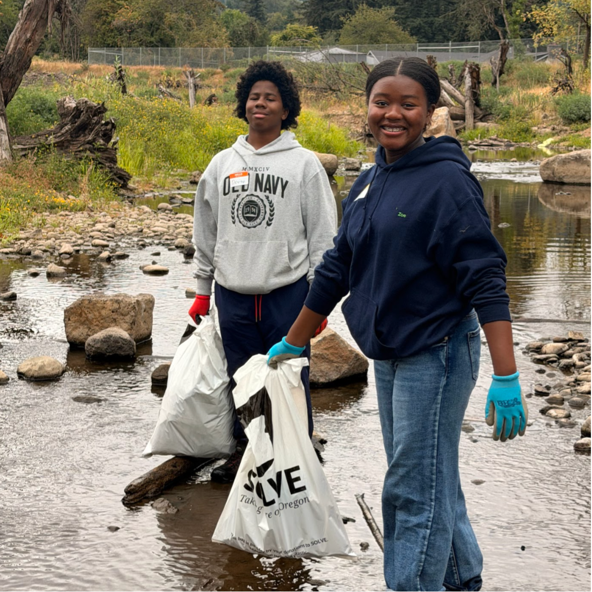 Students smiling in Johnson Creek